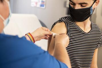 young person being vaccinated